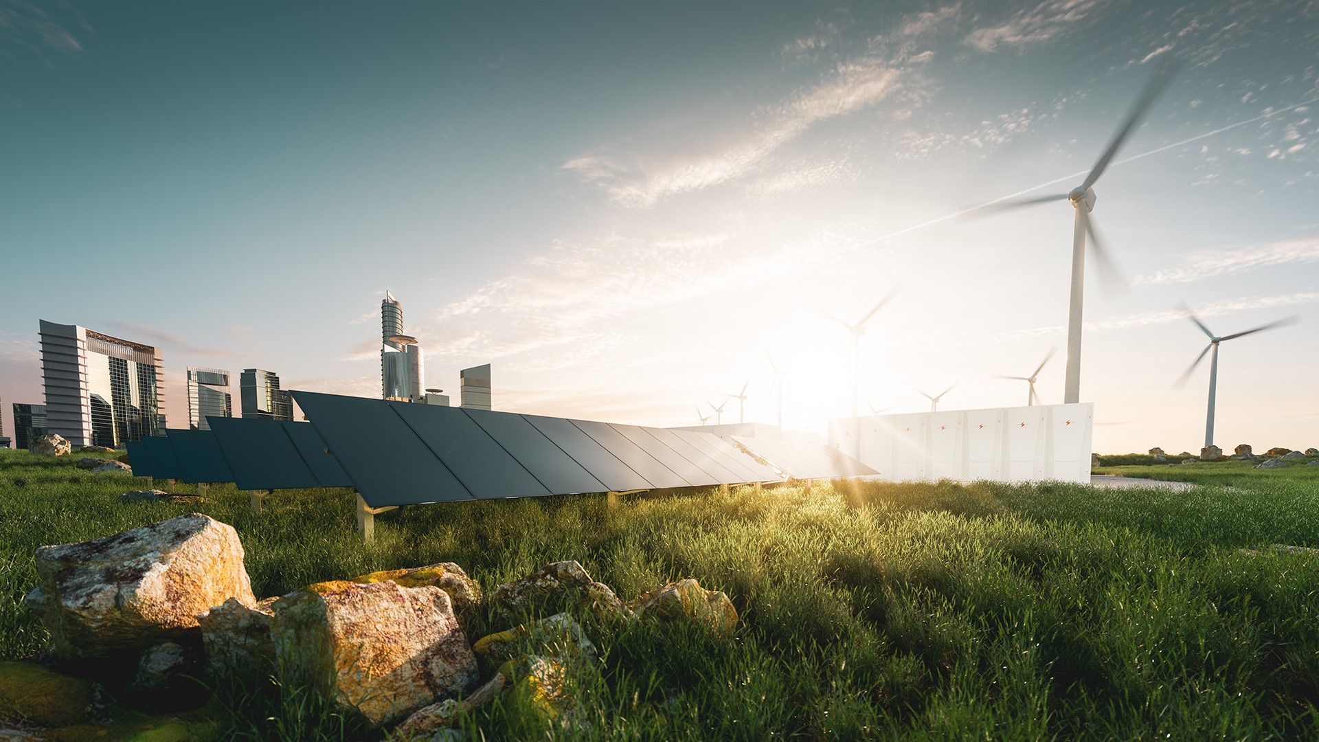 Wind turbines and solar panels at sunset